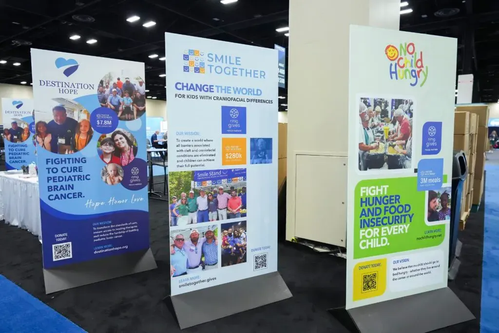 Three banner signs at an expo booth